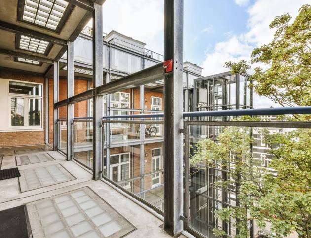 Attractive long narrow balcony Attractive long narrow balcony with glass railings
